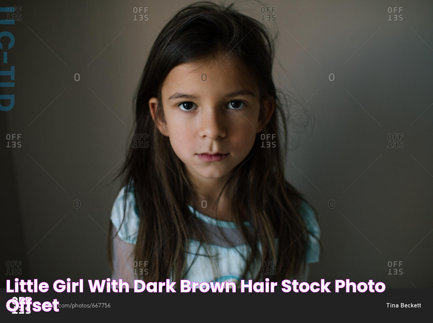 Little girl with dark brown hair stock photo OFFSET